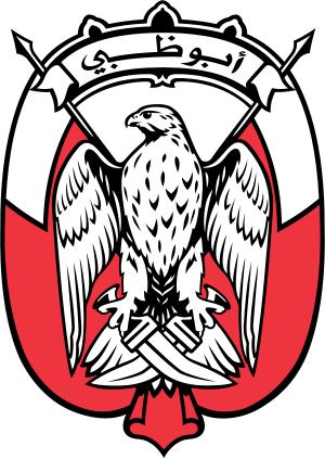 Emblemet för Abu Dhabi med en falk med korsade svärd och arabisk skrift på en röd och vit sköldbakgrund