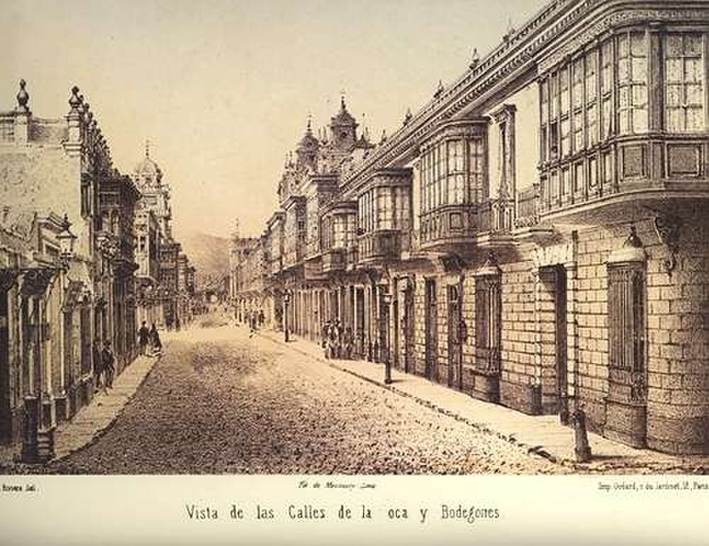 Kolonial gatubild med balkonger och kullerstenar Historisk sepia gatubild av kolonial arkitektur med balkonger och kullerstensväg i en latinamerikansk stad