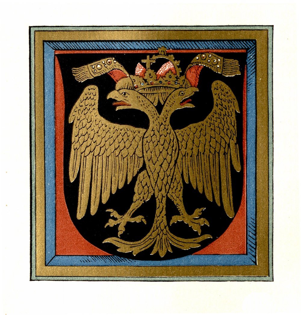 Medeltida dubbelhövdad örn heraldiskt emblem Medeltida heraldiskt emblem med en gyllene dubbelhövdad örn med krona på en svart och röd sköldbakgrund